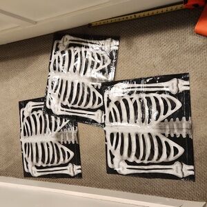 3 Skeleton bags. Yard decor?